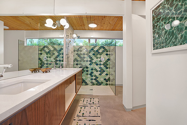 Modern bathroom with turquoise shower tiles 