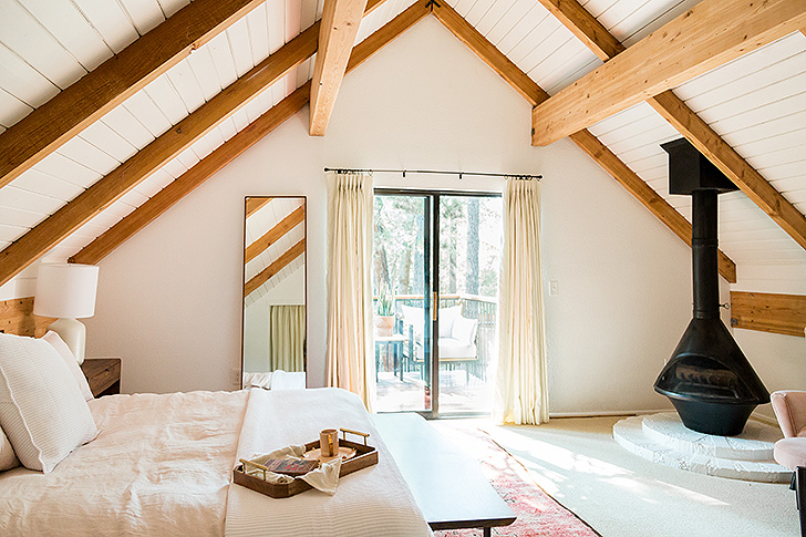 A-frame master bedroom with fireplace