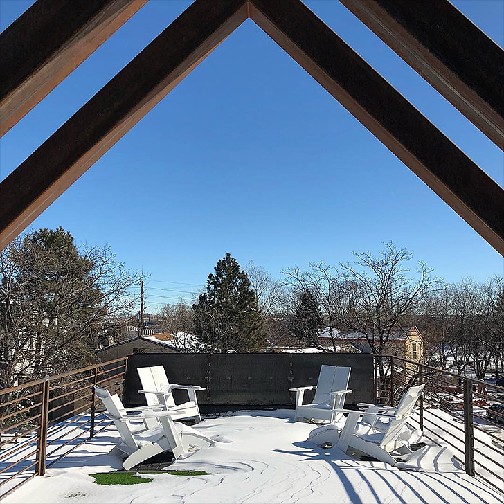 Four outdoor chairs in the snow