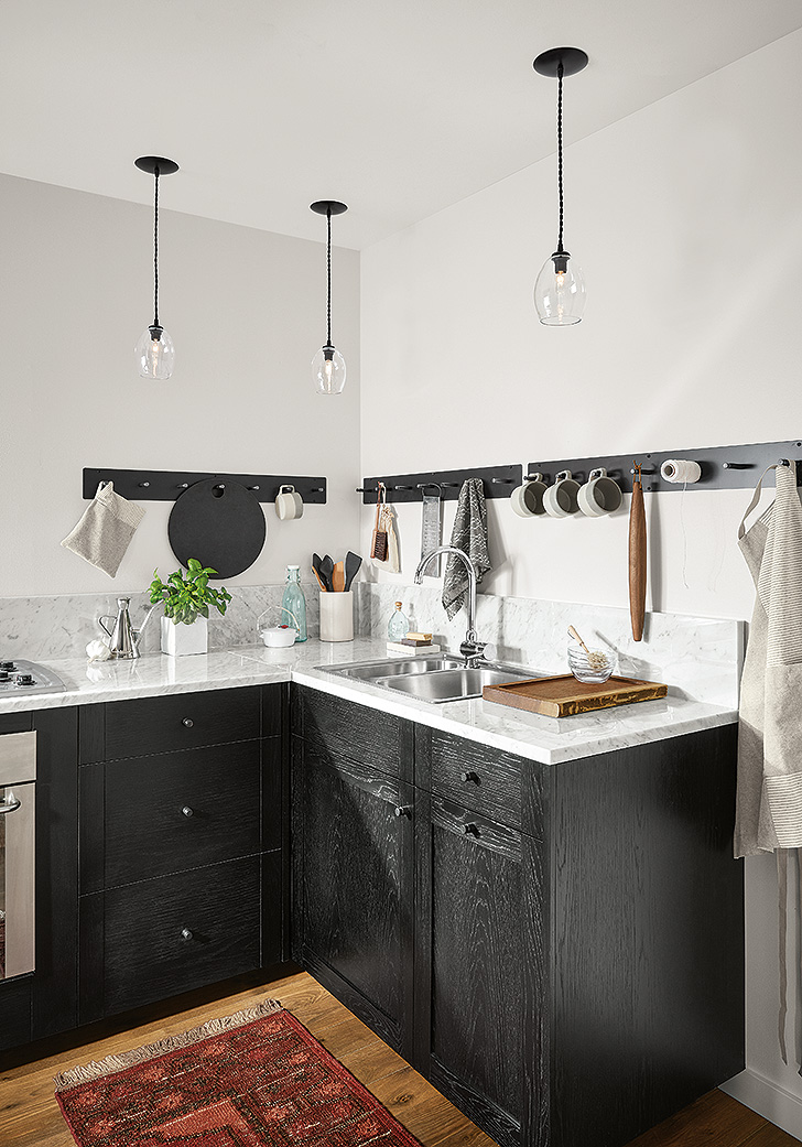 Modern farmhouse kitchen with black cabinets