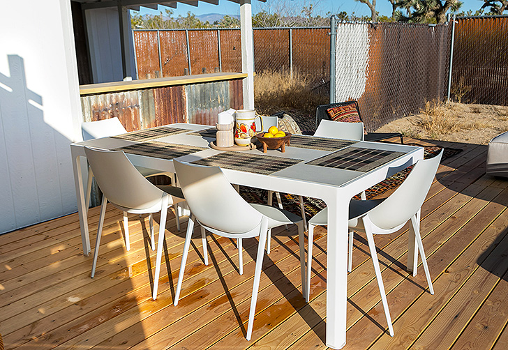 Crescent table and Hoop chairs on deck