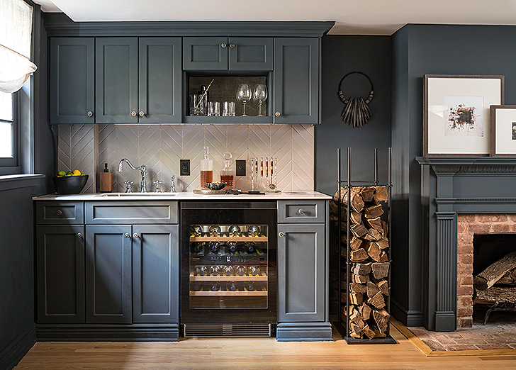 Navy bar cabinets in modern basement