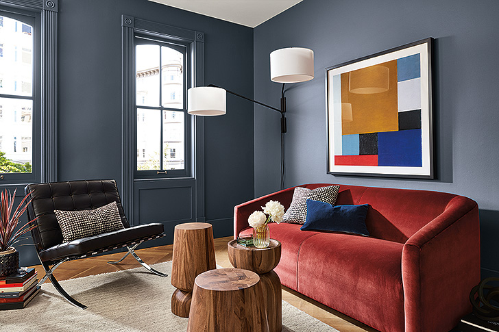Detail of living room with dark blue paint on walls
