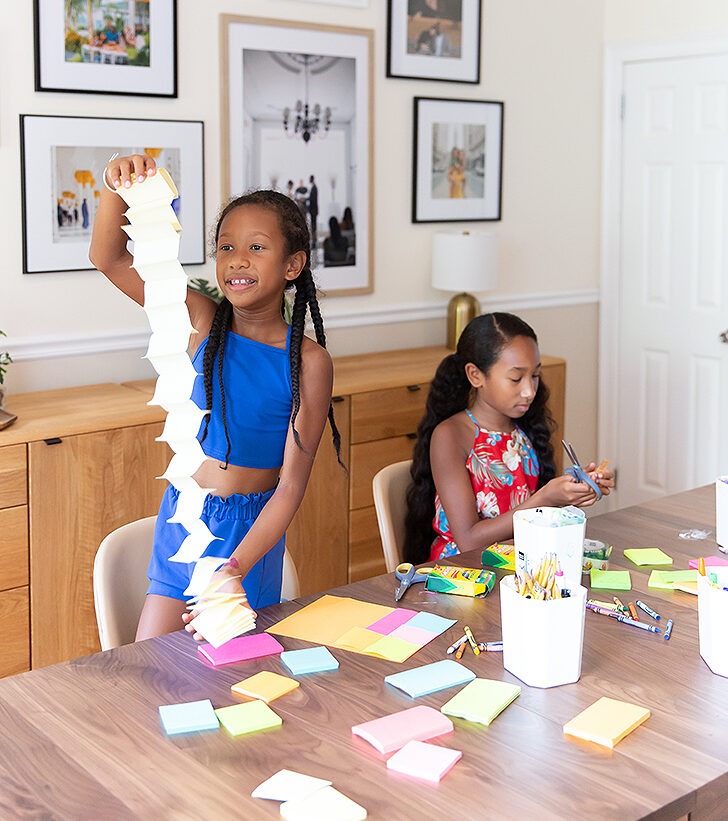 kids doing crafts at dining table