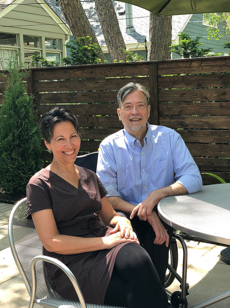 Jean Sazevich and Dave Hedlund in the backyard of their home.