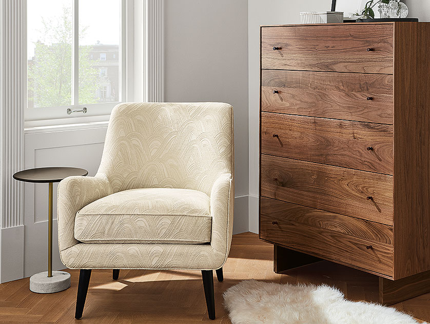 Cream Quinn midcentury modern chair with modern wood walnut dresser 