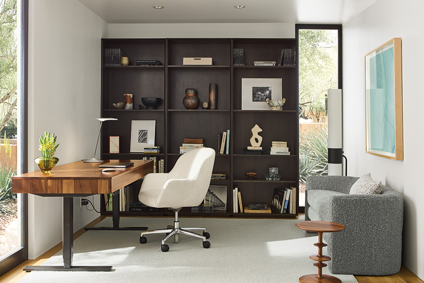 Home office with Aedric adjustable standing desk in walnut and Nico office chair in Laino bone leather.