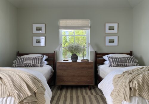 Grove twin beds and dresser in bedroom.