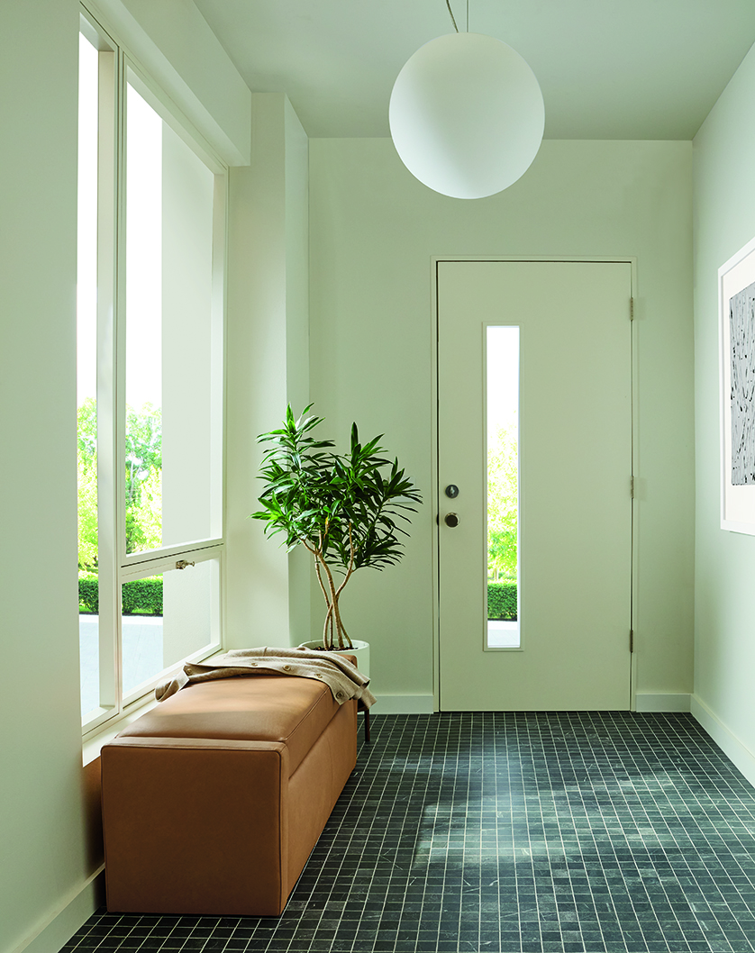 Entryway with Blakely 48-wide storage bench in laino camel leather and sfera pendant light in white.