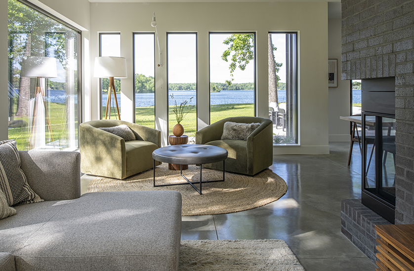 Living room in a modern lake house with 2 Ada chairs and a Sterling sofa.