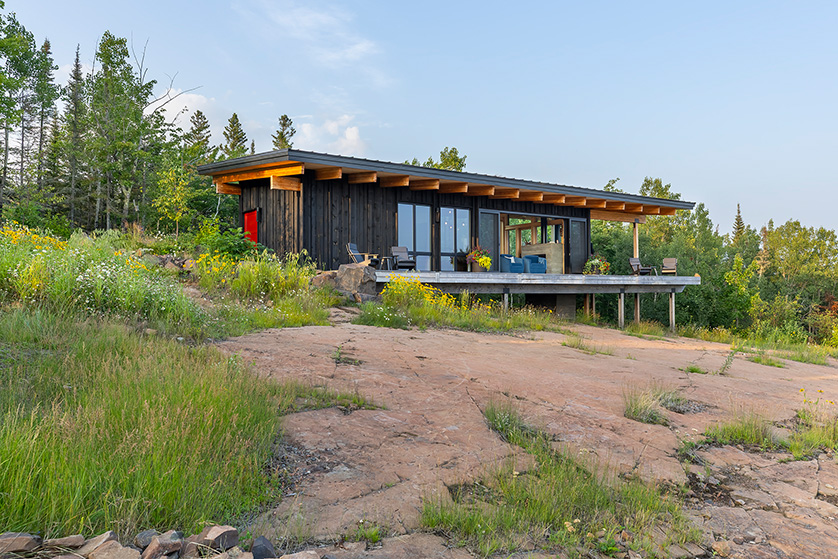 Small modern cabin exterior.